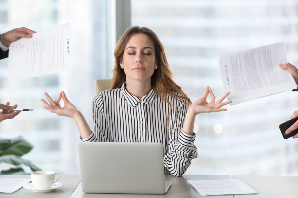 calm-female-executive-meditating-taking-break-avoiding-stressful-job-picture-id1129638579.jpg