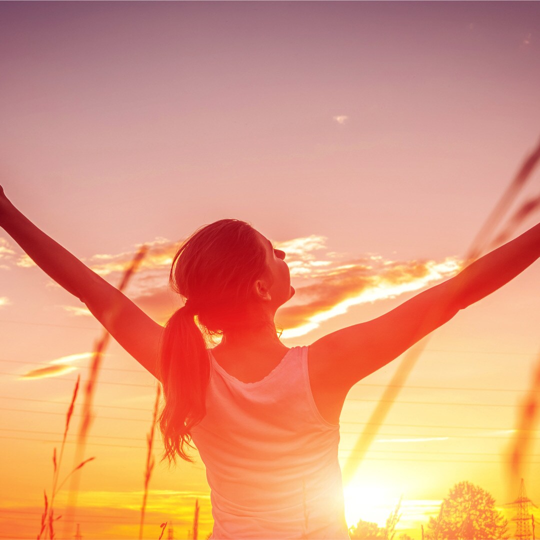 free-and-happy-woman-raises-arms-against-the-sunset-sky-harmony-and-picture-id1131849259(3).jpg