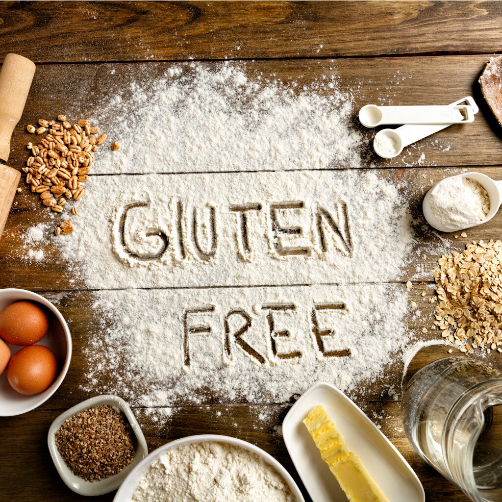 gluten-free-bread-ingredients-and-utensils-on-wood-frame-background-picture-id649878614.jpg