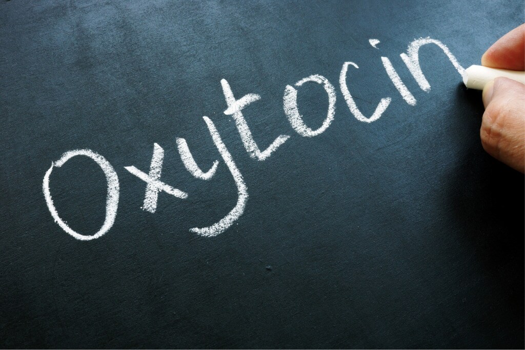 oxytocin-oxt-hormone-handwritten-on-the-blackboard-picture-id1182386080.jpg