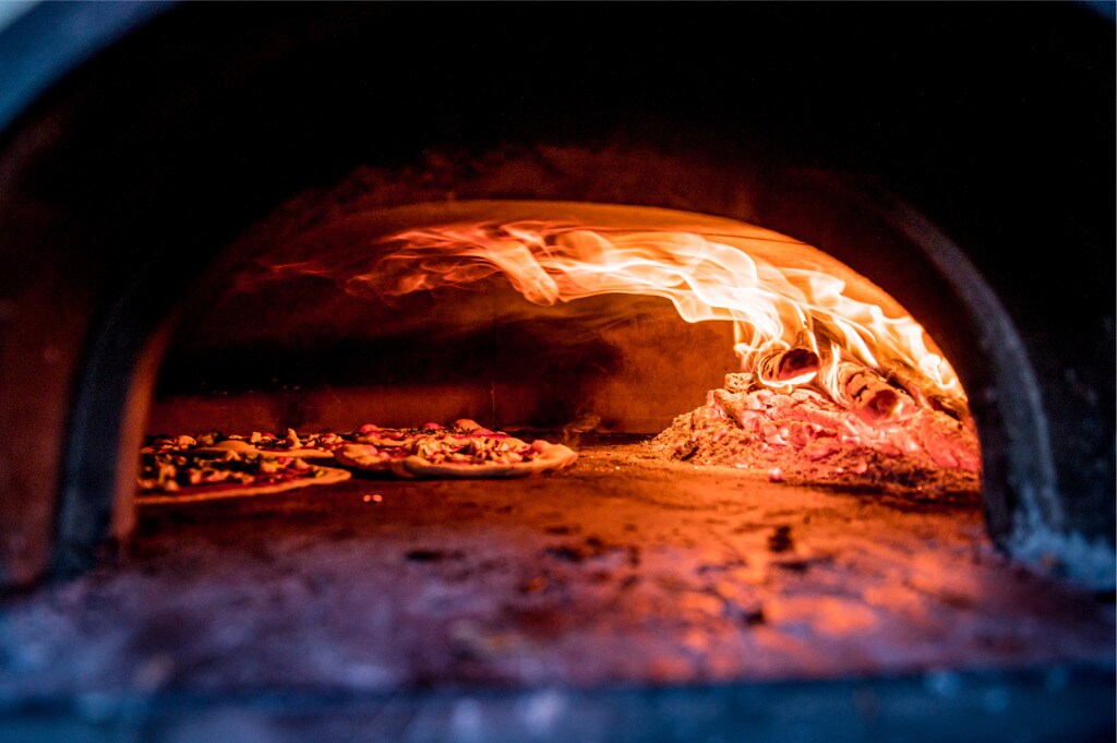 pizza-in-pizza-oven-picture-id1162342351.jpg