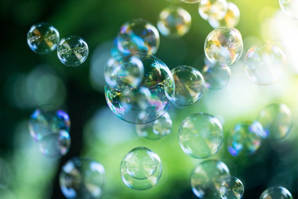soap-bubbles-floating-in-the-air-summer-time-picture-id1134301441.jpg