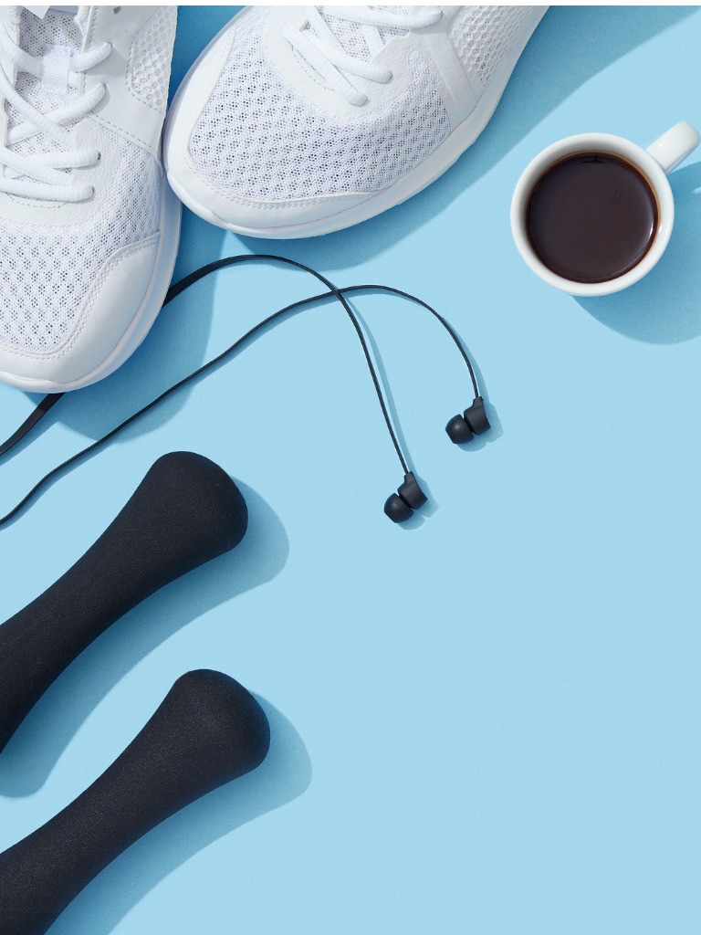 sports-equipment-and-accessories-shoes-dumbbells-earphones-and-coffee-picture-id898789804.jpg